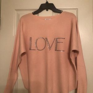 This is a very soft nice sweater, never worn still will tags. The size is a Med